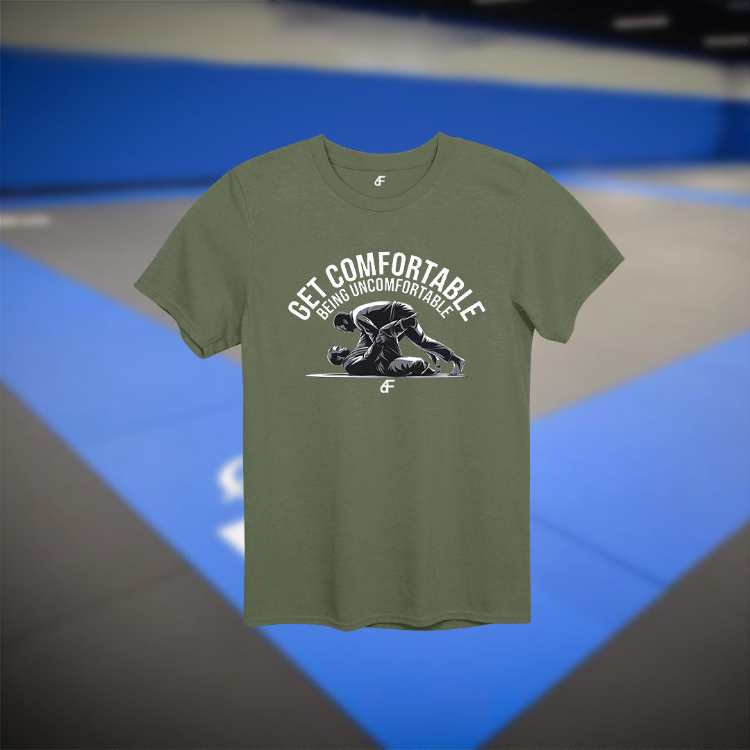 Military green t-shirt with monochrome BJJ rolling illustration and “Get Comfortable” text – tough, focused apparel for mat warriors
